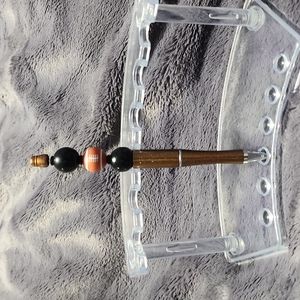 HANDMADE DECORATIVE FOOTBALL PEN. Includes pouch.